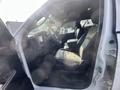 Interior view of a 2012 RAM 2500 showing two front seats dashboard and door controls