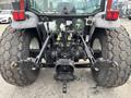 A 2009 New Holland T4020 tractor featuring large rear tires and a visible hitch assembly with hydraulic attachments