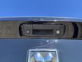 Close-up of the rearview camera and tailgate handle on a black 2015 RAM 1500 truck