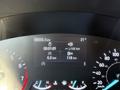 A car dashboard display showing a 2020 Ford Escape with information including odometer reading 69936 km and fuel consumption metrics