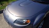 A 2007 Mazda Miata with a sleek design featuring a rounded hood and prominent headlights shown from a top angle