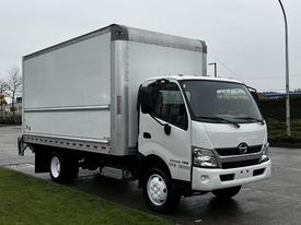 A white 2018 Hino 195 truck with a large silver box cargo area and a single cab designed for commercial use