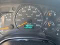The image shows the dashboard of a 2005 GMC C7500 Topkick with various gauges including speedometer fuel gauge and odometer displaying mileage in kilometers
