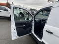 A white 2017 Ford Transit Connect with the driver's side door open showcasing the interior and dashboard