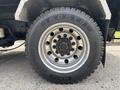 Close-up of a wheel on a 2013 Kenworth T370 featuring a large tire with the brand name KORYO and a silver rim with multiple bolts