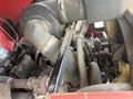 Close-up view of the engine components of a 2013 Toro Grounds Master 5910 showing the air intake and various pipes and belts
