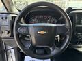 2020 Chevrolet Silverado steering wheel with a central Chevy logo and dashboard gauges visible through the spokes