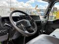 Interior view of a 2022 International MV607 truck showing the steering wheel dashboard and driver's seat