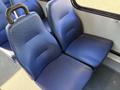 Two blue upholstered seats from a 2019 Chevrolet Express vehicle arranged side by side with a textured surface and a slight curve in the backrest