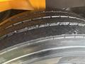Close-up view of a tire from a 2013 International 4300 with visible tread patterns and surface wear