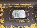 A weathered manufacturer’s plate from a 2017 John Deere 50G excavator showing model and serial numbers with yellow paint peeling around the edges