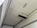 The interior ceiling of a 2019 Ford F-750 with a mounted air conditioning unit