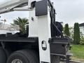 A 2013 Freightliner 114SD truck with a mounted crane and large tires is shown from the side with visible components of the crane assembly