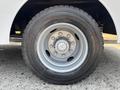Close-up of a metal wheel rim with a central hub and a black tire on a 2006 Sterling Acterra vehicle