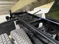 View of the undercarriage of a 2020 Chevrolet Silverado showing the frame suspension and dual rear tires