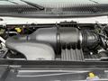 A close-up view of the engine compartment of a 2017 Ford E450 showcasing the air intake system and surrounding components