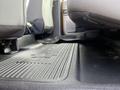 Floor mat and interior space of a 2017 Ford F-250 SD with seats in the upright position showing a clean and spacious area