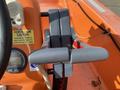 Close-up of the control levers on a 2007 Fassmer 20 Foot Fast Rescue Boat with an orange interior and a safety instruction label nearby