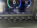 A digital display of a 2020 Lion Lion6 showing speedometer, battery range, average consumption, and various control buttons
