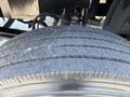 Close-up of a tire on a 2007 GMC C4500 TopKick showing tread wear and grooves