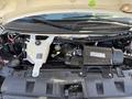 The image shows the engine compartment of a 2017 Chevrolet Express with the engine components exposed including the Vortec engine and coolant reservoir
