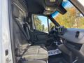 Interior view of a 2024 Mercedes-Benz Sprinter 2500 showing two front seats and a dashboard with various controls and displays