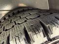 Close-up of a tread pattern on a tire from a 2017 Chevrolet Express showing deep grooves and ridges for traction