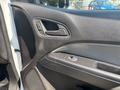 Interior door panel of a 2017 Chevrolet Colorado featuring window controls door handle and textured surface