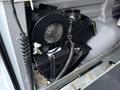 A 2016 GMC Savana's internal component featuring a black fan assembly connected to a plastic housing with wires attached