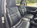 Front seats of a 2014 Honda CR-V featuring black leather upholstery and seat belts