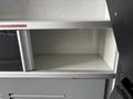 A 2020 Mercedes-Benz Sprinter 2500 with an open storage compartment revealing an empty interior space