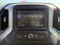 2022 GMC Sierra 1500 dashboard display with radio interface showing AM FM options and song information