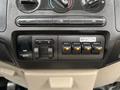 Control panel with buttons and switches for audio gain output auxiliary connections and a beacon light for a 2008 Ford F-350