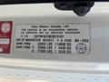 A detailed vehicle information label for a 2012 Hino 338 showing specifications such as VIN, weight capacities, and date of manufacture