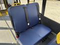 Two blue fabric seats with seat belts in a Ford Transit-350 designed for passenger transport