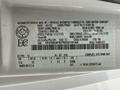 A 2024 Ford E-450 vehicle identification label displaying manufacturing information and specifications