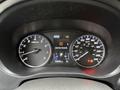 Dashboard of a 2016 Mitsubishi Outlander displaying speedometer and low tire pressure warning with odometer reading 150935 km