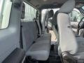 Interior of a 2014 Ford F-250 SD featuring gray cloth seats with a bench design and adjustable front seats