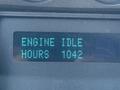 Digital display showing the text ENGINE IDLE HOURS 1042