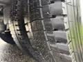 Close-up of a 2014 Freightliner B2 tire showing detailed tread patterns and visible wear on the rubber surface