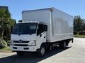 A 2018 Hino 195 truck with a white box cargo area and a silver front grille parked with its cab facing forward