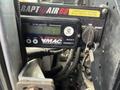 A VMAC RAPTAIR 60 control panel with buttons and a key switch, indicating readiness for operation and warning messages