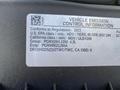 A 2023 GMC Savana emission control information label detailing compliance with U.S. regulations and specifications