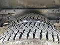 Detail of a tire from a 2018 Ford Econoline showcasing its tread pattern and texture