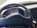 The steering wheel and dashboard of a 2014 International TerraStar showing various gauges and controls