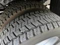 Close-up of a 2016 Ford F-550 tire showing detailed tread pattern and wear on the rubber surface