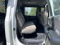 Interior view of a 2017 Ford F-550 showing the back seat with fabric upholstery and a spacious cabin layout