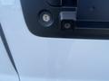 Close-up of the rear door handle and backup camera of a 2022 GMC Savana