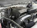 Close-up of the engine compartment of a 2016 Chevrolet Silverado 2500HD showing the air intake and various engine components