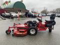 A red 2017 Ferris Rotary mower with a large cutting deck and an ergonomic seat designed for easy maneuverability